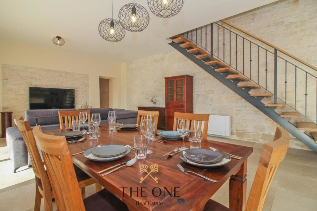 Luxury stone villa with pool, offers 5 bedrooms, 5 bathrooms, fenced yard and private outdoor parking space.