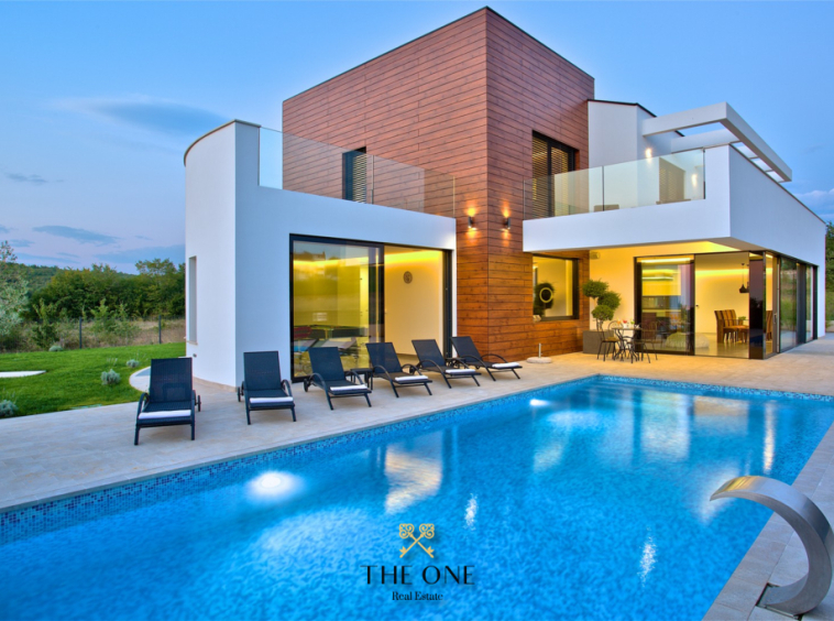 Modern luxury villa with a beautiful panoramic view offers 4 bedrooms, 4 bathrooms, wellness area, private parking.