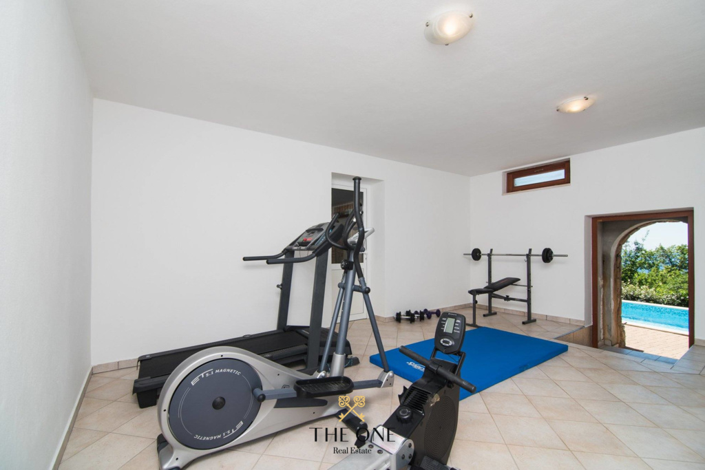 Villa-in-Opatija-for-sale (67) Villa with a pool offers 4 bedrooms, 3 bathrooms, toilet, gym, sauna, private parking space.